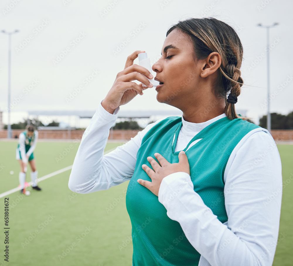 Asma, hockey woman and medical tool for breathing and healthcare outdoor on sport field. Female student, fitness and exercise in a game with training and workout with breathe for wellness and stress