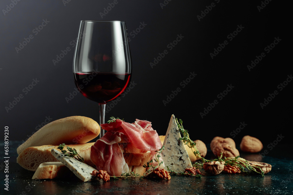 Red wine with traditional Mediterranean snacks.