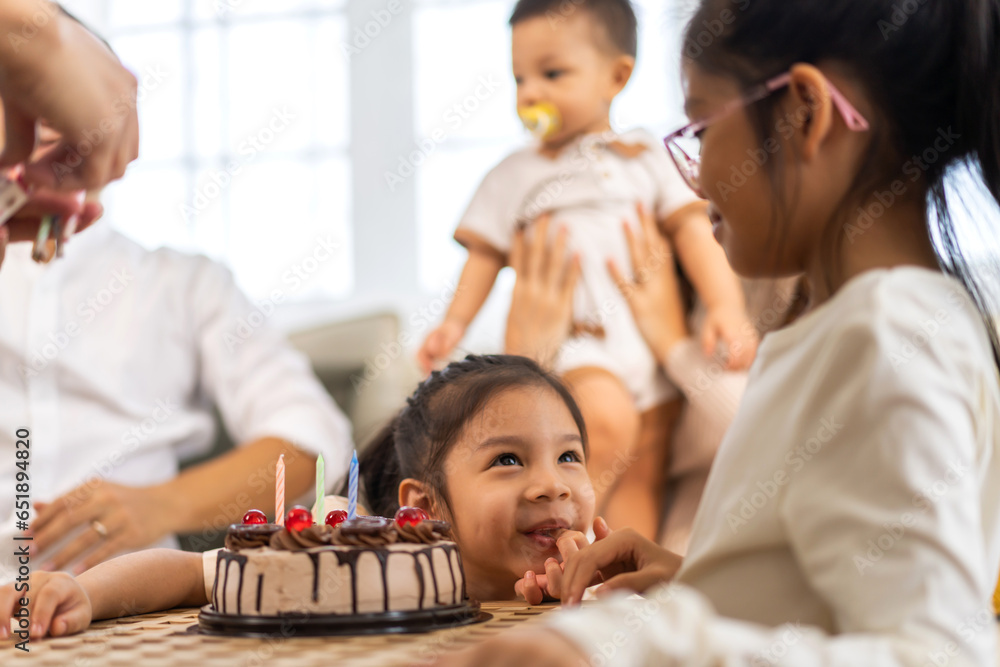 Portrait of happy love asian big family father and mother with asian baby and little girl happy birthday, party, celebration, cake, surprise together.Family party