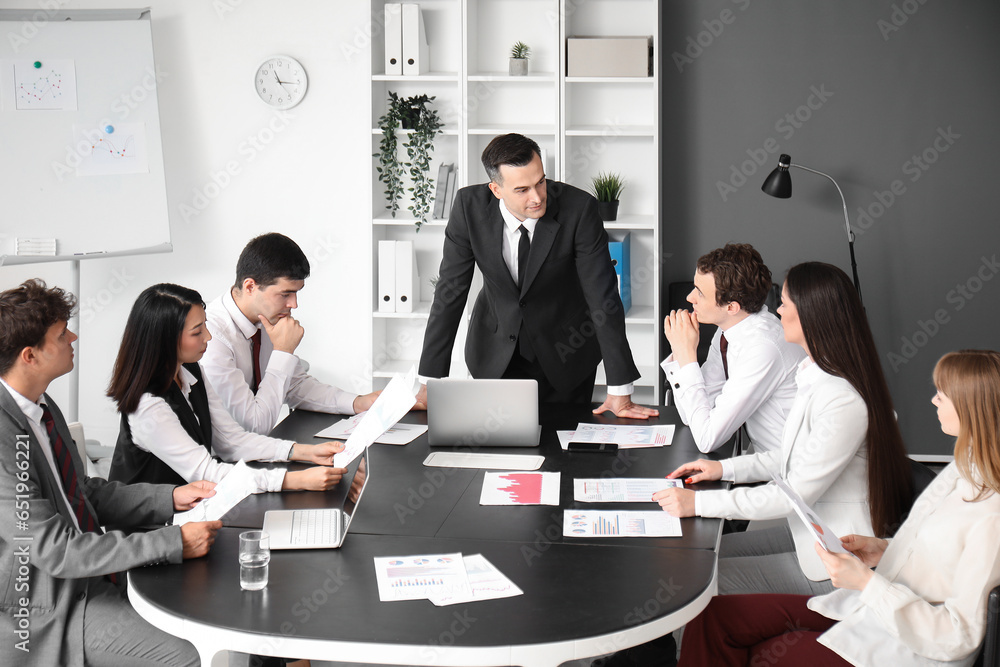 Group of business consultants working in office