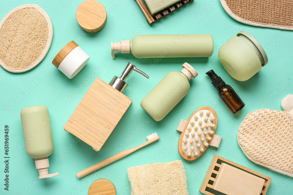 Composition with different bath items and cosmetic products on color background