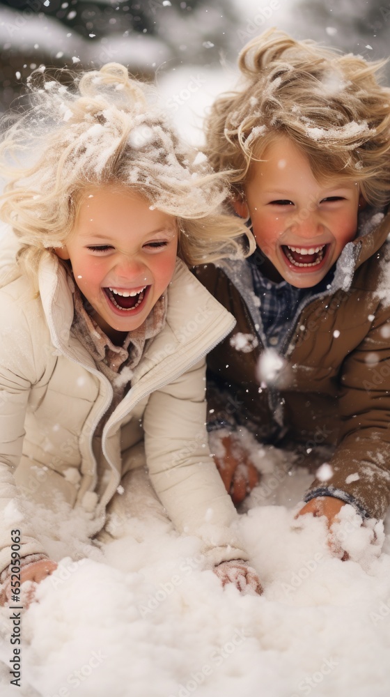 Playful siblings having fun in the snow