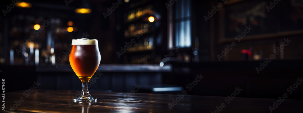 Snifter glass of light beer on bar table in a dark pub with copy space. Generative AI