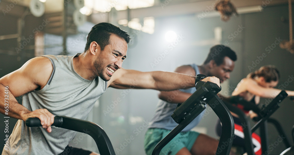 People, diversity and cycling at gym in fitness, workout or intense cardio exercise together and motivation. Diverse group burning sweat on bicycle machine for healthy body, wellness or lose weight