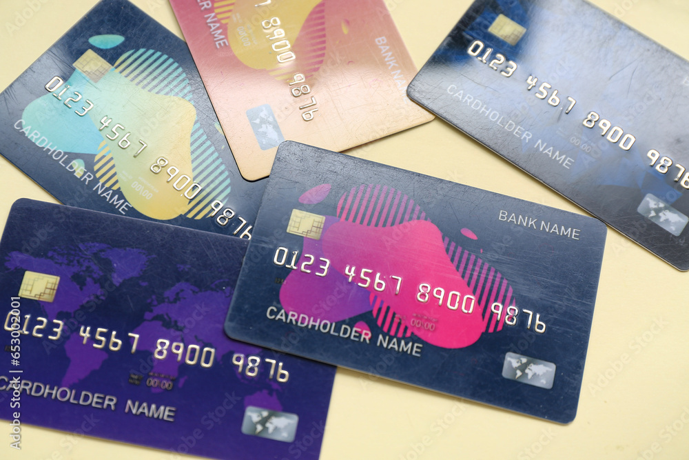 Many credit cards on pale yellow background