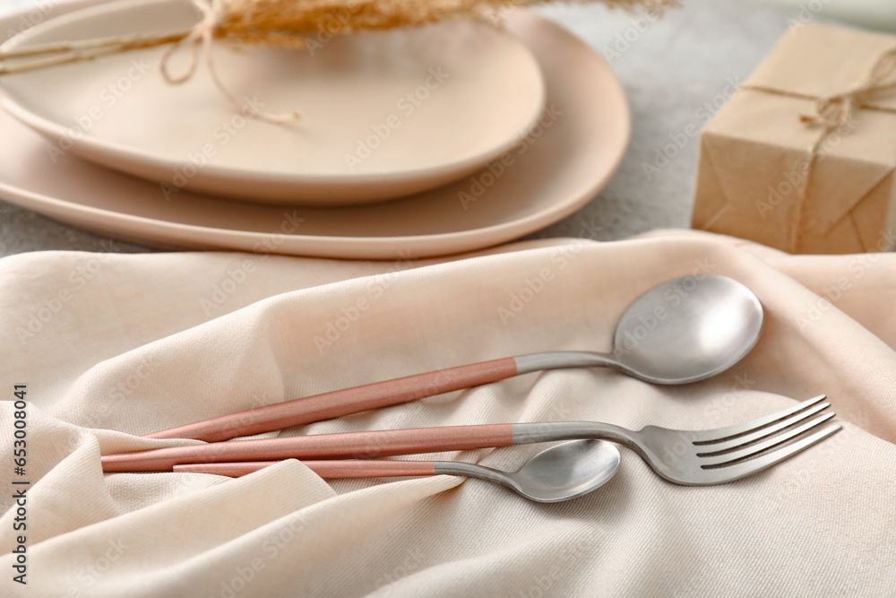 Stainless steel fork and spoons on table