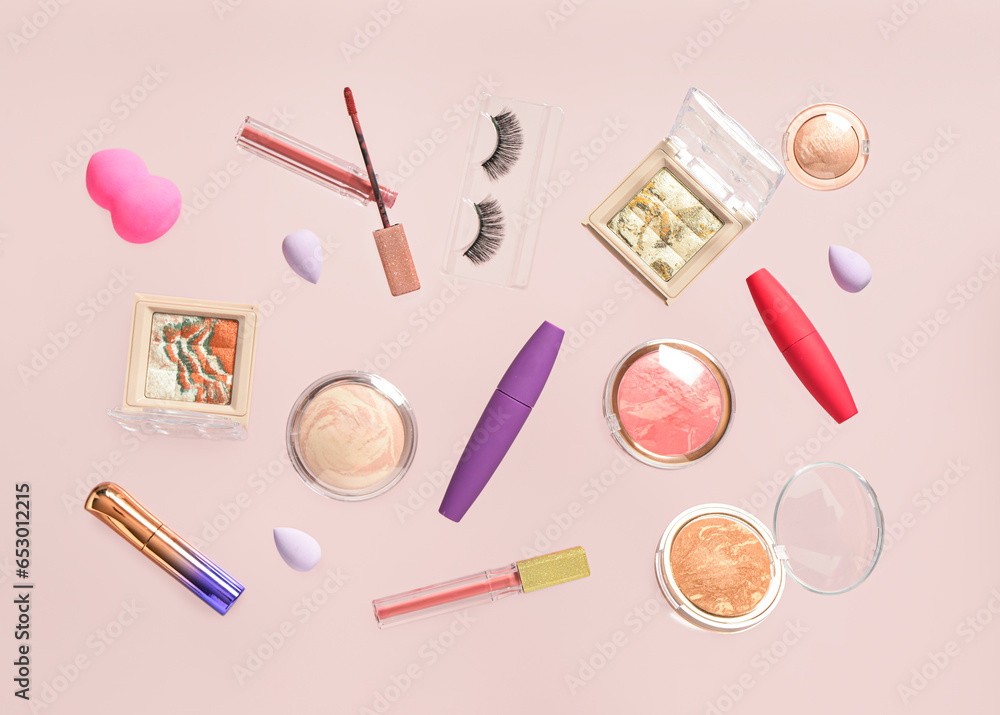 Different decorative cosmetics on lilac background