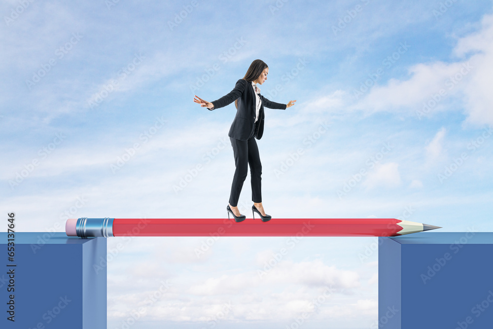 Attractive young european woman crossing pencil bridge on sky background. Career problem and gap concept.