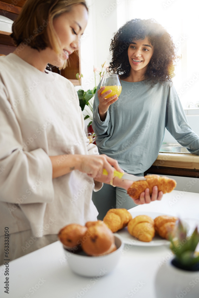 Couple, happiness and women with juice and food in kitchen for breakfast, nutrition and vitamin c in morning. Cooking, people and smile with drink and pajamas or natural face for wellness or fruit