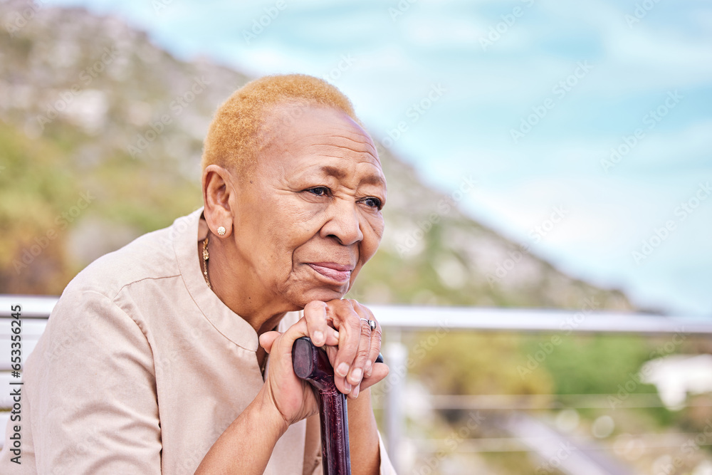 Depression, walking stick and a sad elderly woman on a park bench with nostalgia in nature during summer. Face, summer and a senior person with a disability looking lonely while in the mountains