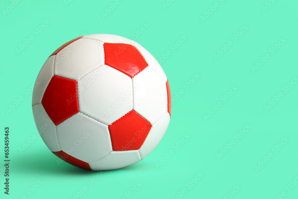 Soccer ball on turquoise background