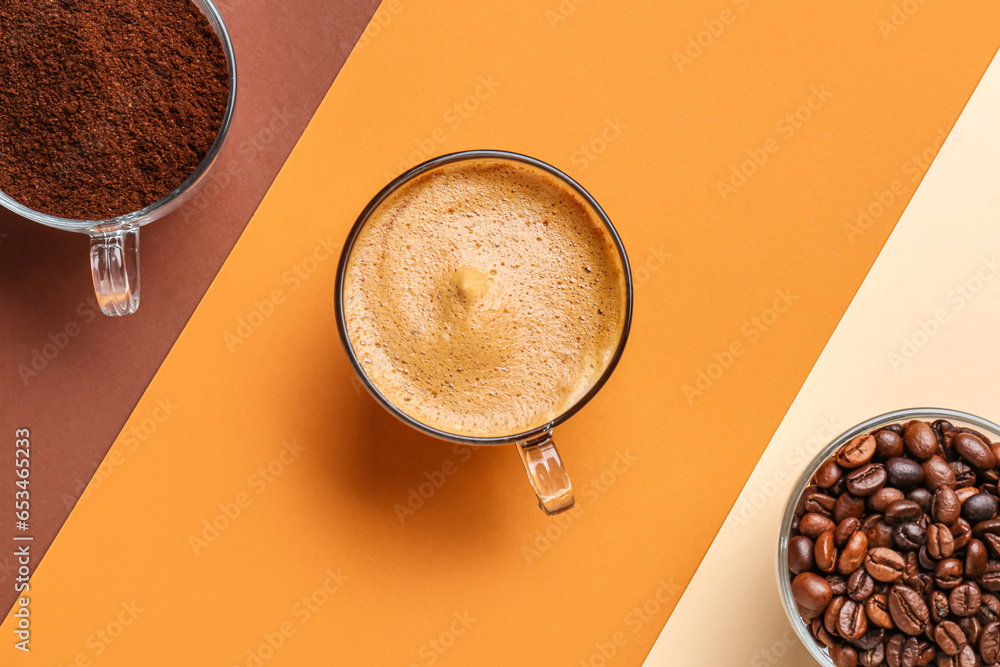 Cups of hot espresso and coffee beans on colorful background