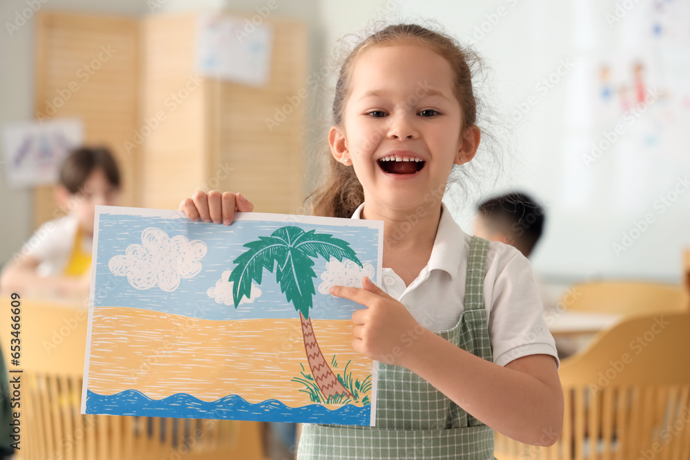 Cute little girl with drawing in art class