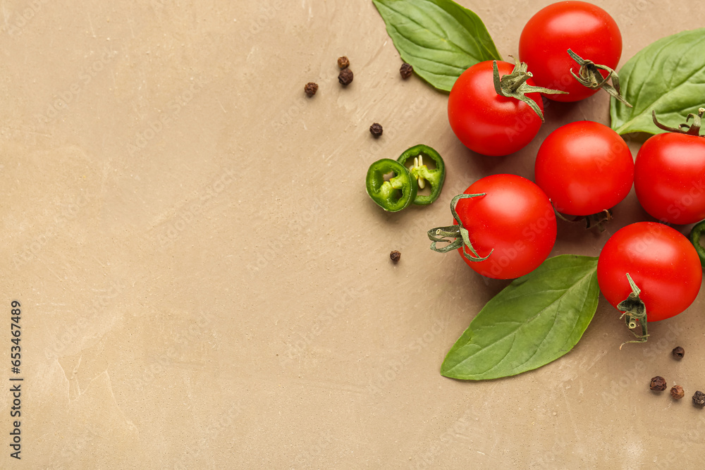 Composition with ripe cherry tomatoes, jalapeno and spices on color background