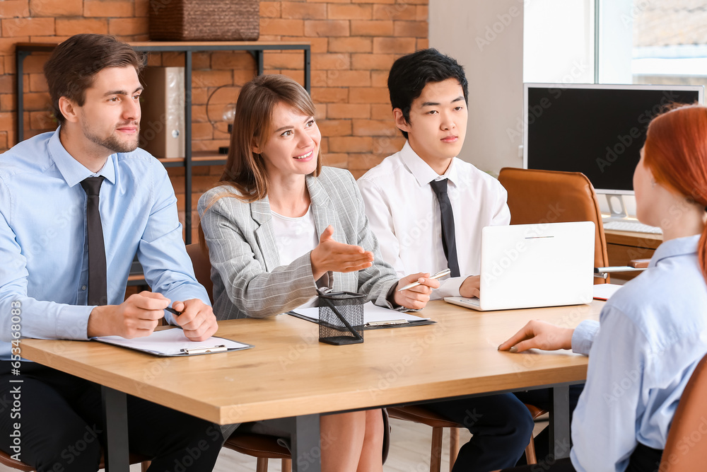 Human resources commission interviewing female applicant in office