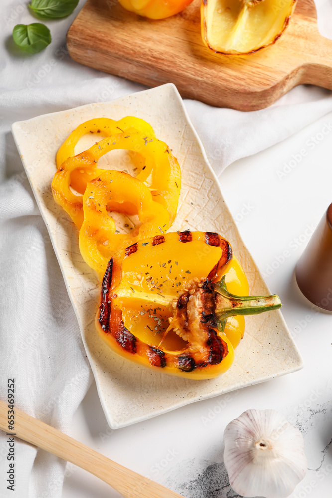 Plate with tasty grilled bell  peppers on table