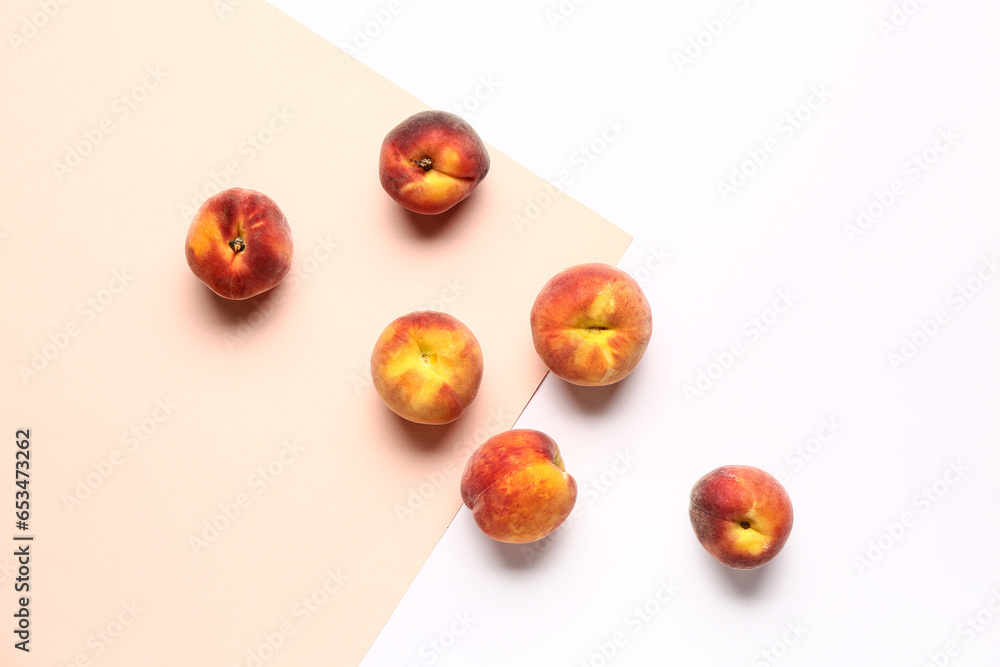 Sweet peaches on colorful background