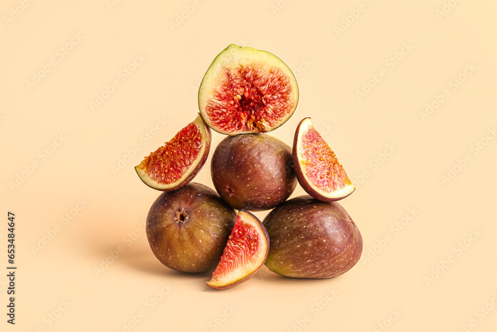 Fresh ripe figs on orange background