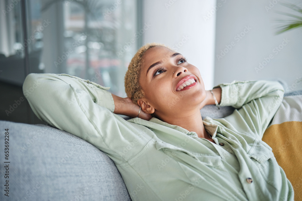 Woman, relax and living room on a couch with a smile and rest with thinking and happy memory. Home, female person and calm in a house with future dream and peace in a lounge with freelancer break