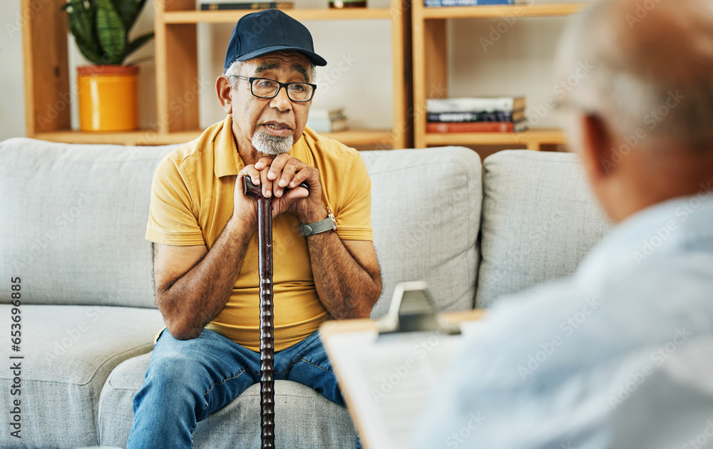 Doctor, consultation and senior man on sofa with walking stick or discussion of physical therapy and checklist. Therapist, consulting and talking to elderly patient on couch in rehabilitation office