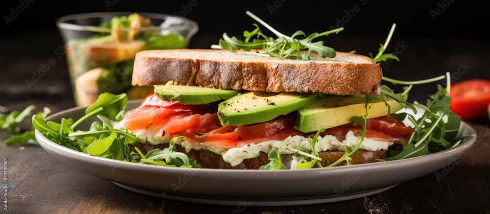 Healthy concept of still life with light soft cheese sandwich red fish avocado and egg for a summer meal