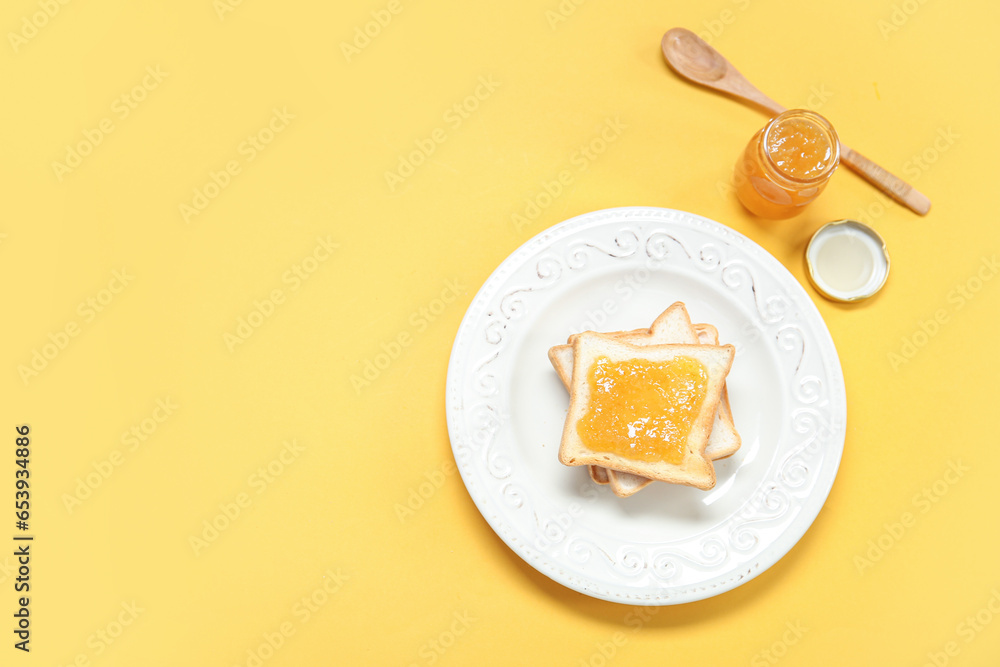 Plate of tasty toasts and jam on color background