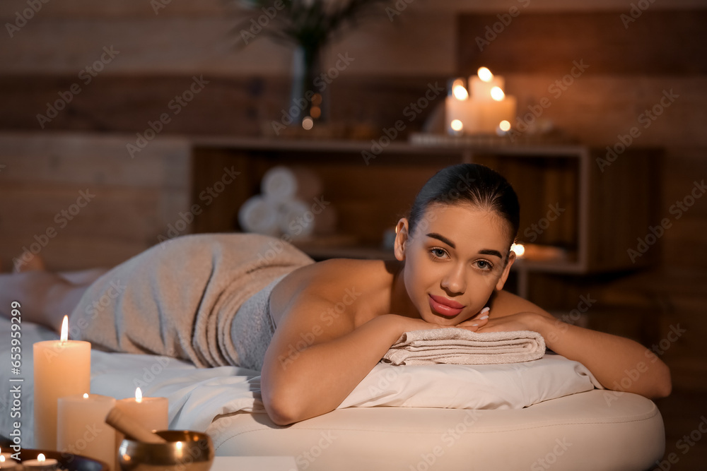 Pretty young woman in spa salon