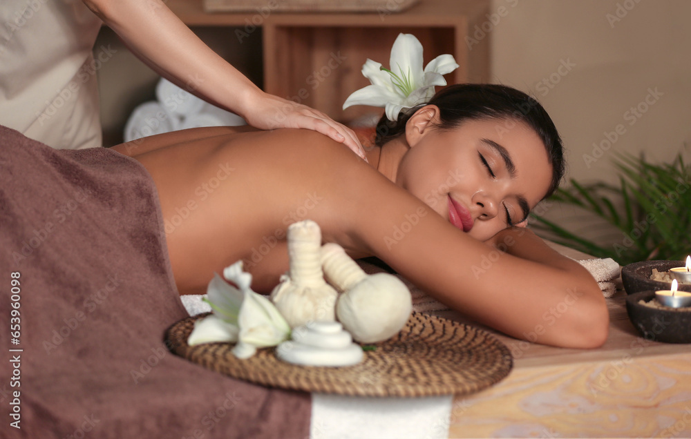 Beautiful woman receiving spa massage in salon