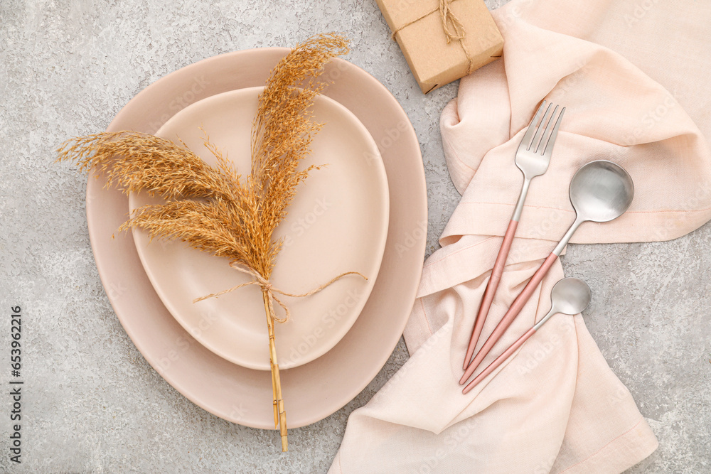 Beautiful table setting on grey background