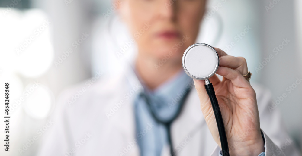 Stethoscope, hand and woman doctor closeup with healthcare, medical work and hospital job. Wellness check, heart monitoring and clinic with a female professional with working and health consulting