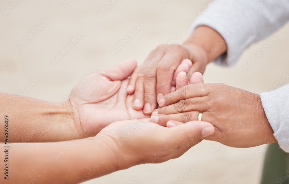 Hand holding, couple and marriage on beach, ring and love in commitment ceremony, anniversary or celebration. Wedding, man or woman on holiday, bonding together or closeup for support, care or peace