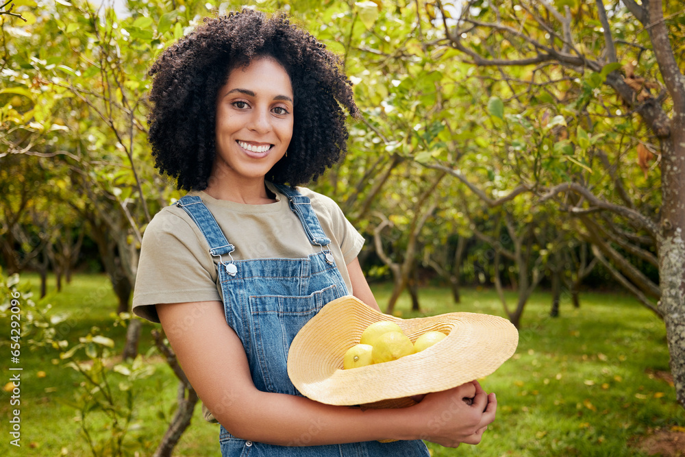 Woman in orchard, nature and agriculture with lemon in portrait, healthy food and nutrition with citrus farm outdoor. Farmer, picking fruit and smile with harvest, sustainability and organic product