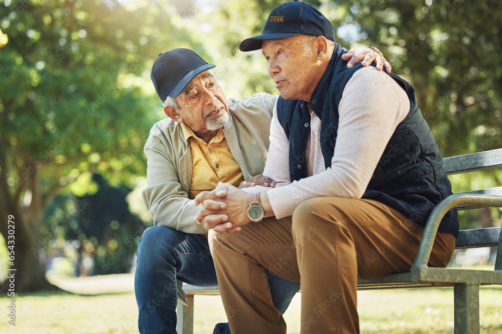 Elderly men, park and comfort with friends, nature and communication with support in retirement. Empathy, closeup and senior people in conversation with trust, together and care on bench in summer