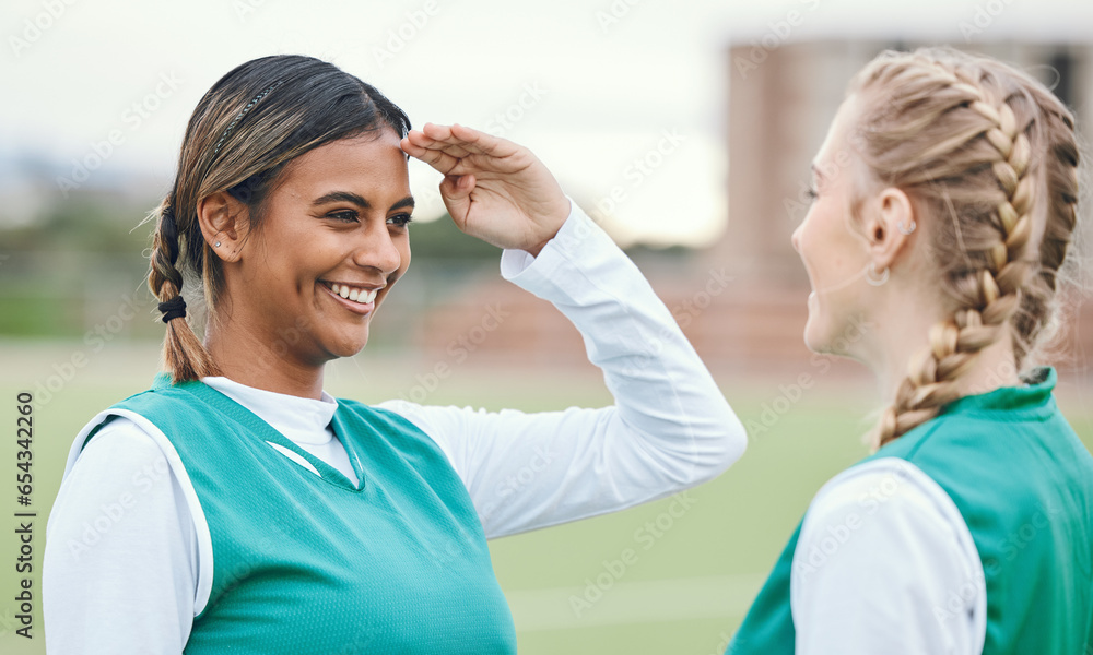 Woman, friends and hockey salute for fun on sports field for game in competition, training or fitness. Female athlete, play and exercise for outdoor contest in sun for strong workout, cardio or smile