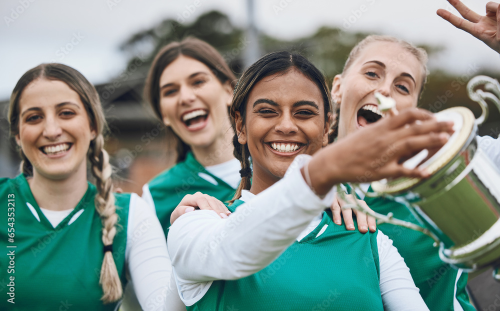 Sports women, team and winning trophy in portrait, celebration and success in competition on field. Champion girl group, friends and diversity for hockey, goal or happy outdoor at stadium for contest