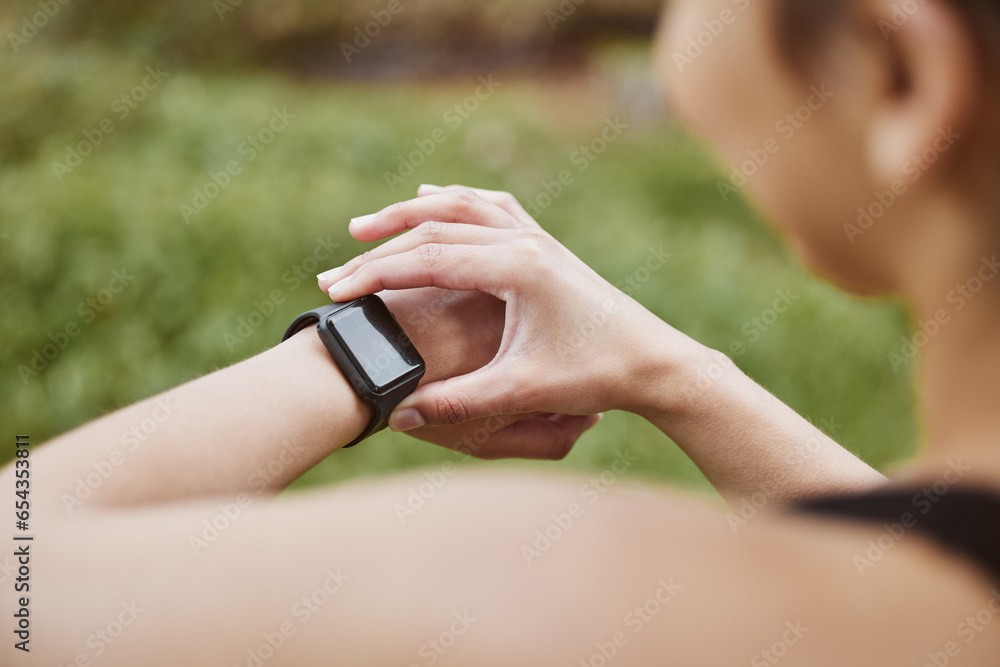 Hands, runner girl and check smart watch in park for steps, data or time app with results, fitness or nature. Woman, iot clock or monitor for speed, sport or reading for exercise, workout or health