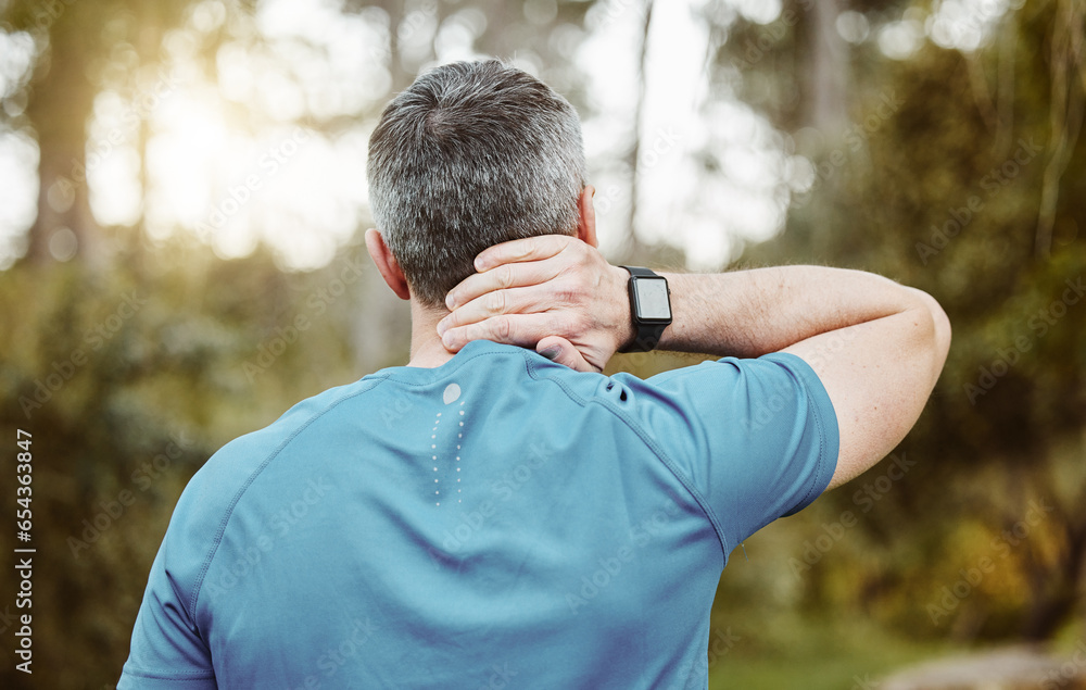 Back of a man, neck pain and outdoor for fitness, wellness and exercise in a park with injury. Morning, mature athlete accident and strain in nature with workout and sports inflammation of the spine