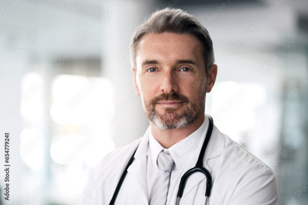 Mature doctor, portrait and man in hospital for healthcare, wellness and career in clinic. Face, medical professional and confident expert surgeon, therapist worker and senior employee in Canada.