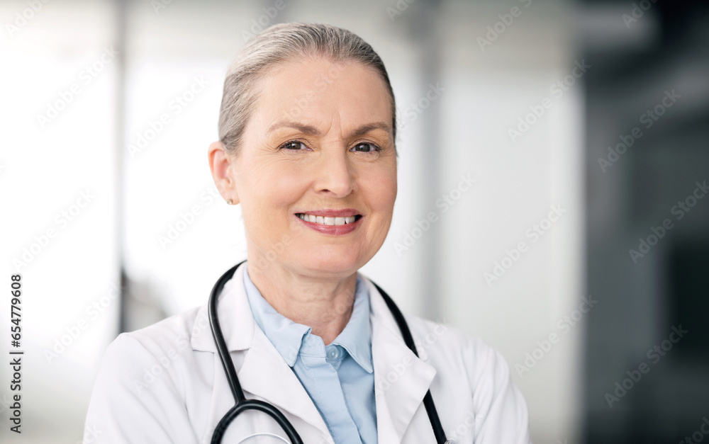 Mature doctor, portrait and happy woman in hospital for healthcare, wellness or career in clinic. Face, medical professional smile and confident expert surgeon, therapist worker or employee in Canada