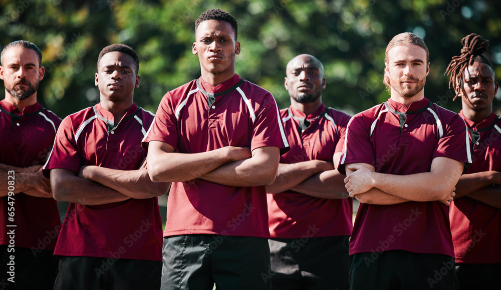 Team, men and field for athlete in portrait with arms folded, united and determined with mindset to win. Diverse group, players and together with intense, rugby sports and face for victory in game