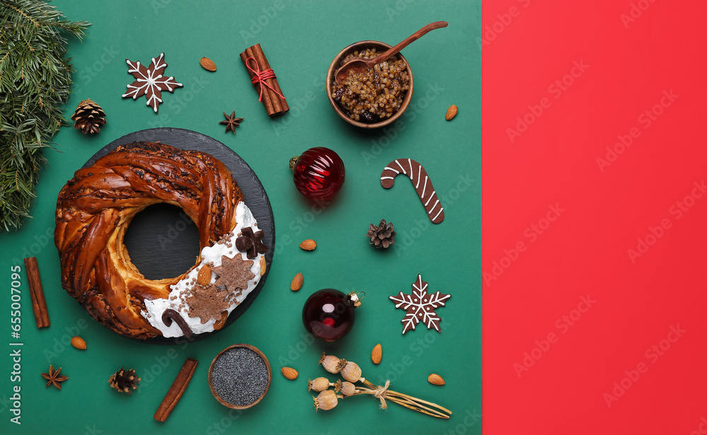 Composition with tasty Christmas pastry wreath, Kutya, decorations and spices on color background