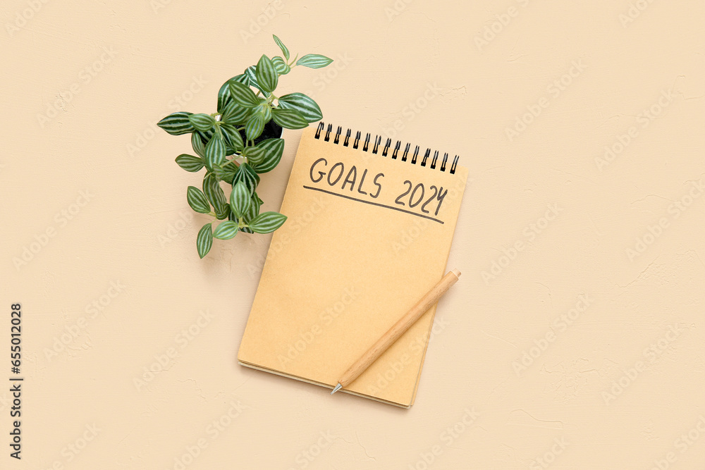 Notebook with empty to do list, pen and houseplant on beige background. New year goals