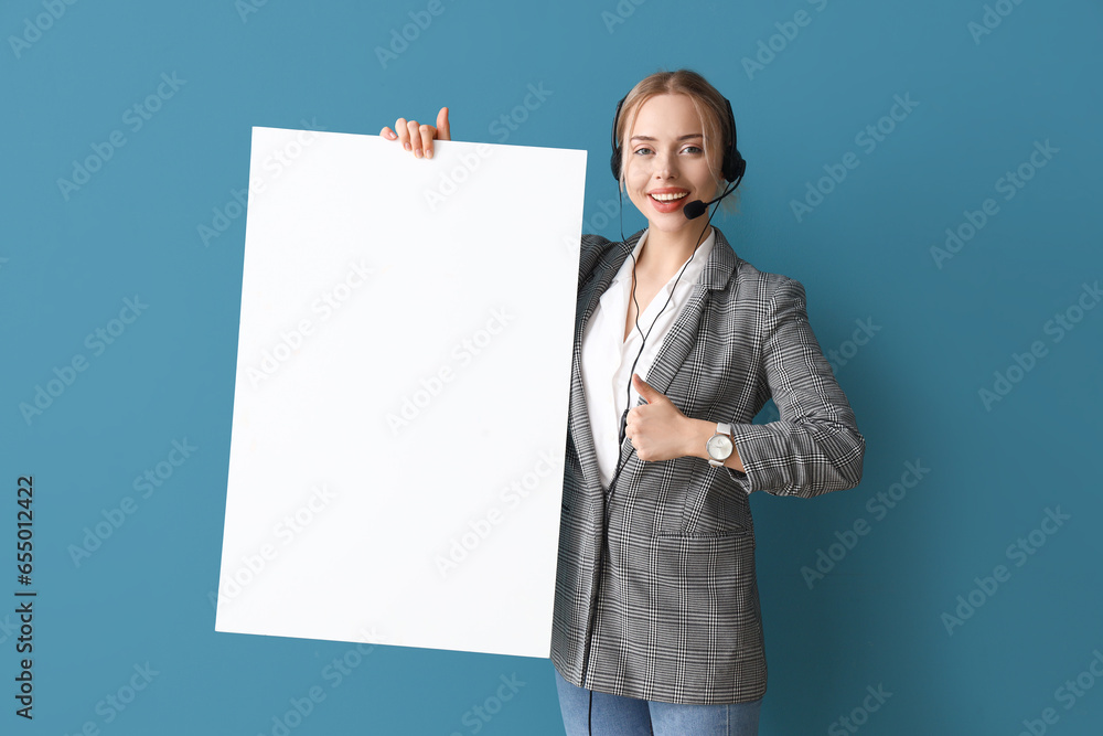 Female technical support agent with blank poster on blue background