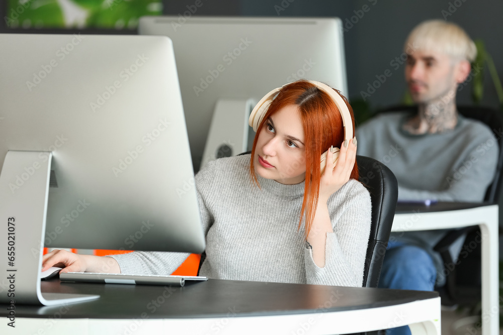 Young programmers working in office