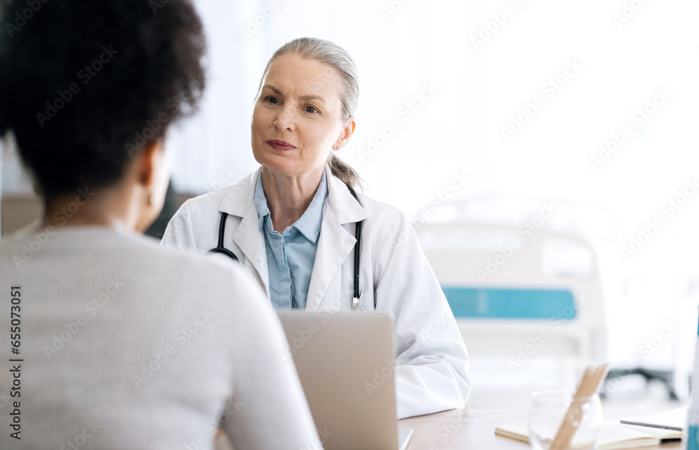 Woman doctor, medical consultation and computer at hospital with patient discussion and surgery info. Wellness advice, technology and mature professional with healthcare, consulting and talking