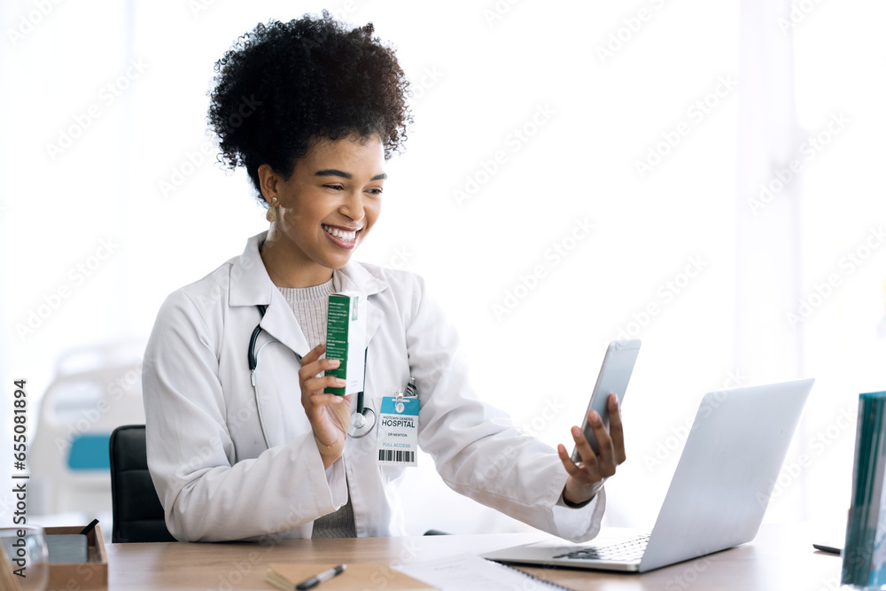 Doctor, woman and pills in video call or phone communication for healthcare or telehealth service in office. Afrcan person or medical worker with medicine product for virtual consultation on mobile