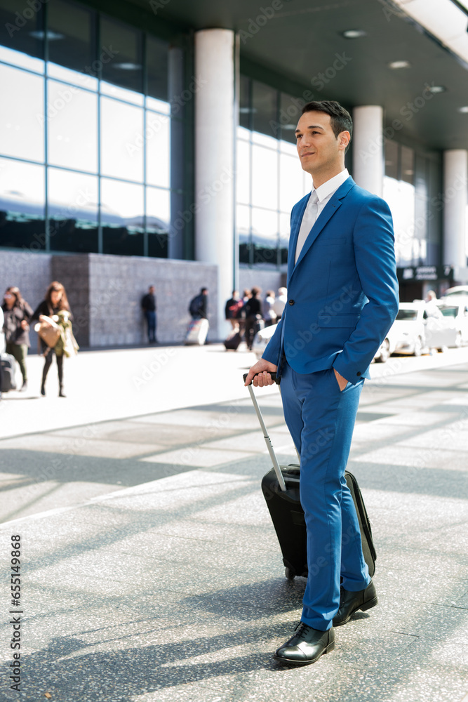 Businessman pulling a trolley in the airport