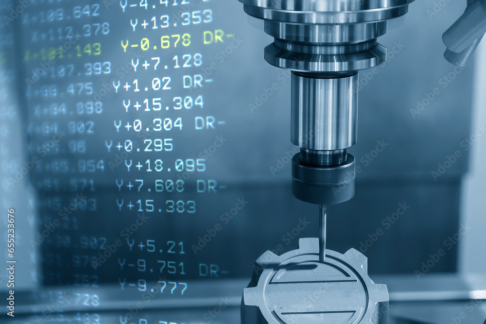 Abstract scene the CNC milling machine cutting the graphite electrode parts and G-code data background.