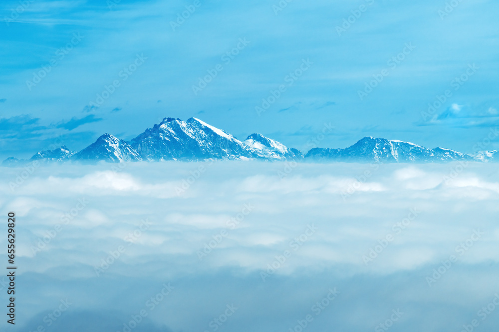 High Julian Alps mountain peaks above the clouds