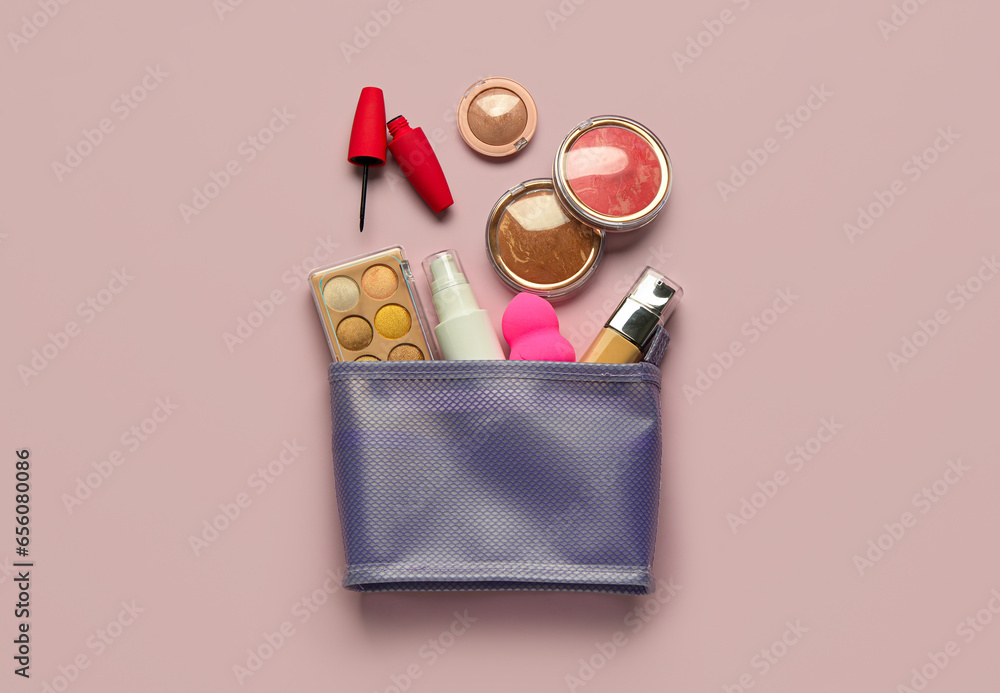 New cosmetic bag with makeup products on purple background